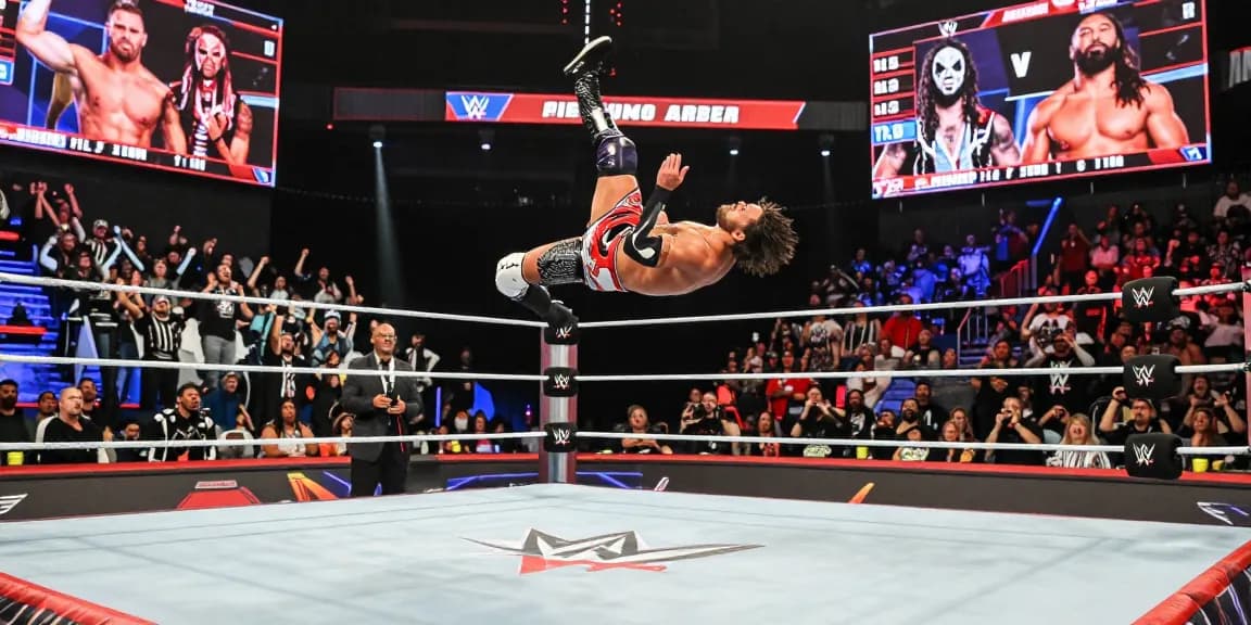 WWE superstar in action at a wrestling event showcasing stillrealtous excitement and energy.