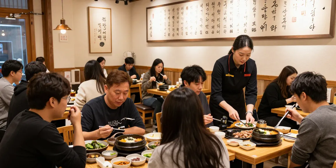 Guests savoring meals at 상봉동 한국관, showcasing a cultural dining experience in a vibrant atmosphere.