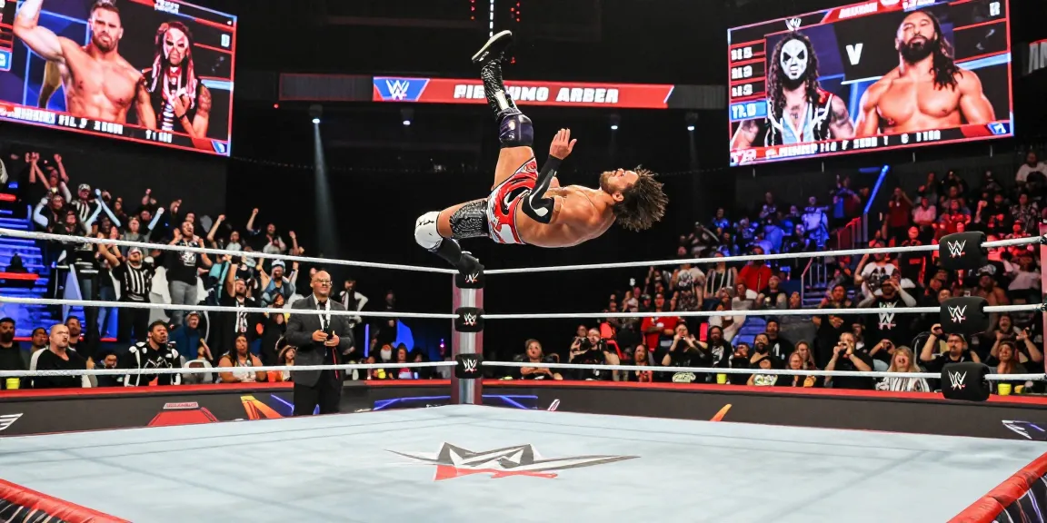 WWE superstar in action at a wrestling event showcasing stillrealtous excitement and energy.